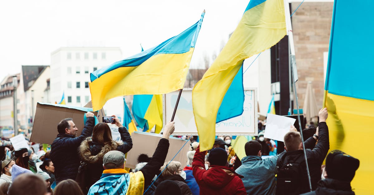 What happened to Eric after the Dauntless invasion simulator? - People Gathering on Street Holding Ukraine Flags 
