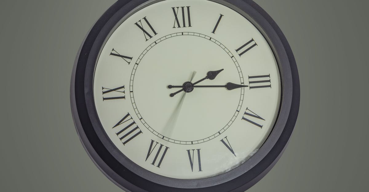 What happened to Gozer the second time around? - Round black mechanical clock with Roman numerals hanging on gray wall
