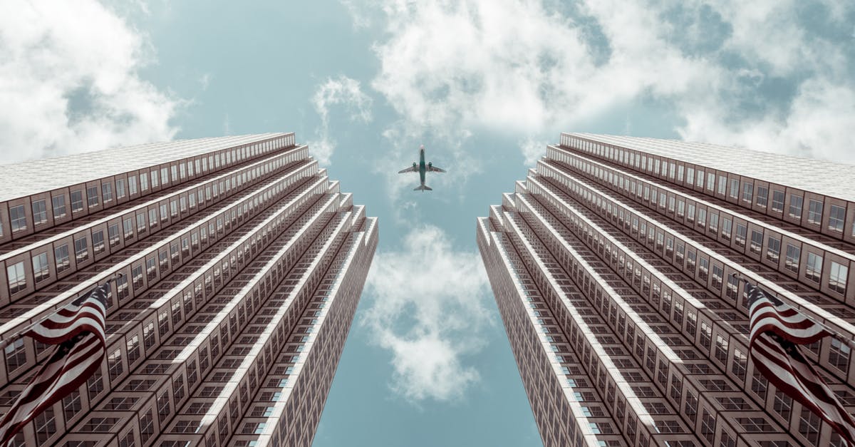 What happened to Rose's Twin? - Worm's-eye view Photo of Plane Between Two High-rise Buildings