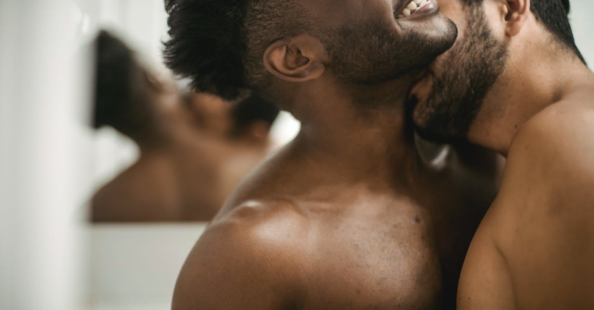 What happened to the other demons? - Shirtless Man Kissing Other Undressed Man on Neck