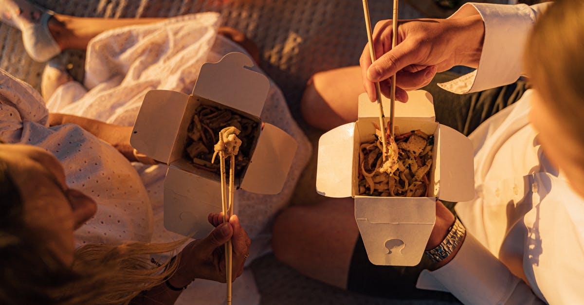 What happens between the scene where Max knocks Noodles out, and the moment Noodles come to? - Person Holding Brown Wooden Chopsticks While Eating Noodles