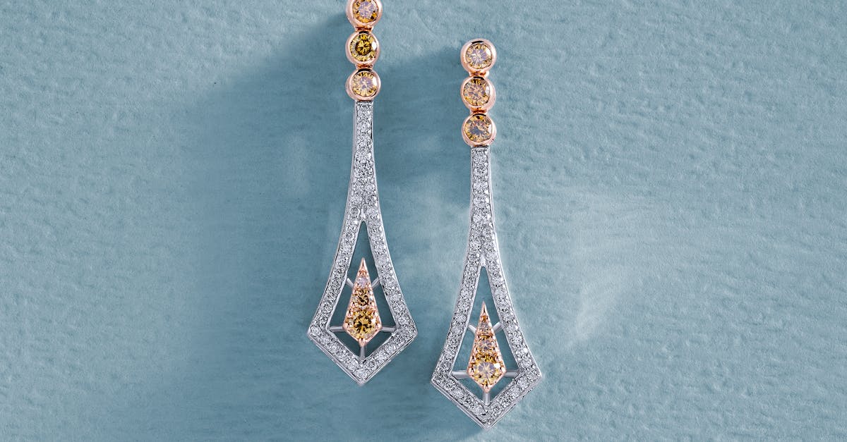 What is a cautionary diamond? - Earrings with Diamonds on Blue Surface