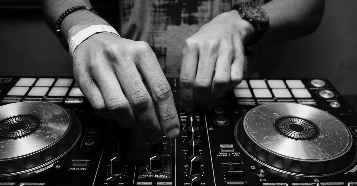What is a layback sound mixer? - Grayscale Photography of Person Using Dj Controller
