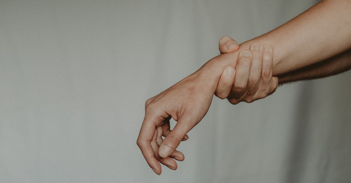 What is a negative pressure test and why did it give the results it did? - Unrecognizable person holding hand of partner abusively