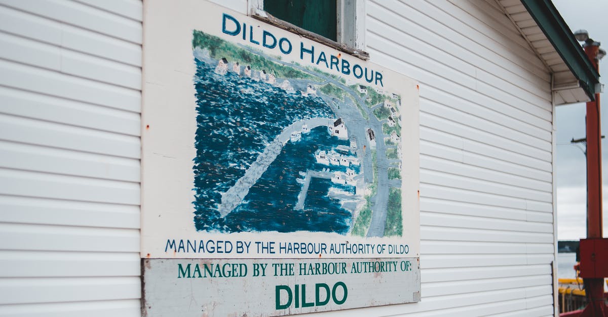 What is Darling's actual name in the show? - Signboard on cottage with location name Dildo Harbour