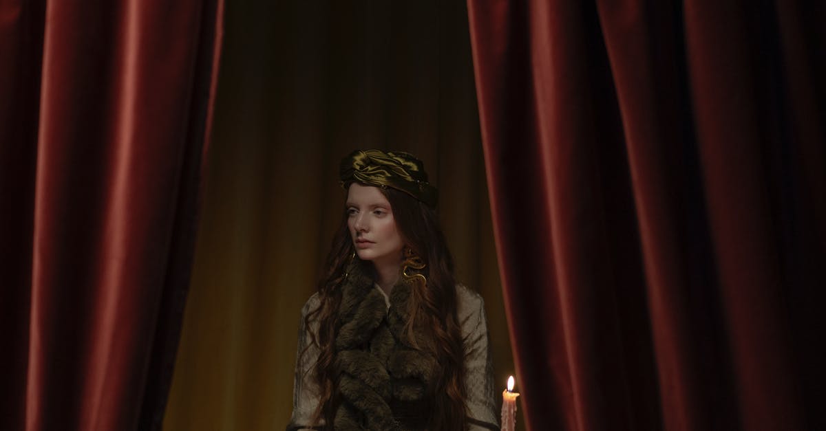 What is David Lynch's obsession with stages, red curtains, and female singers? - Woman in Fur Coat with Red Curtain Background