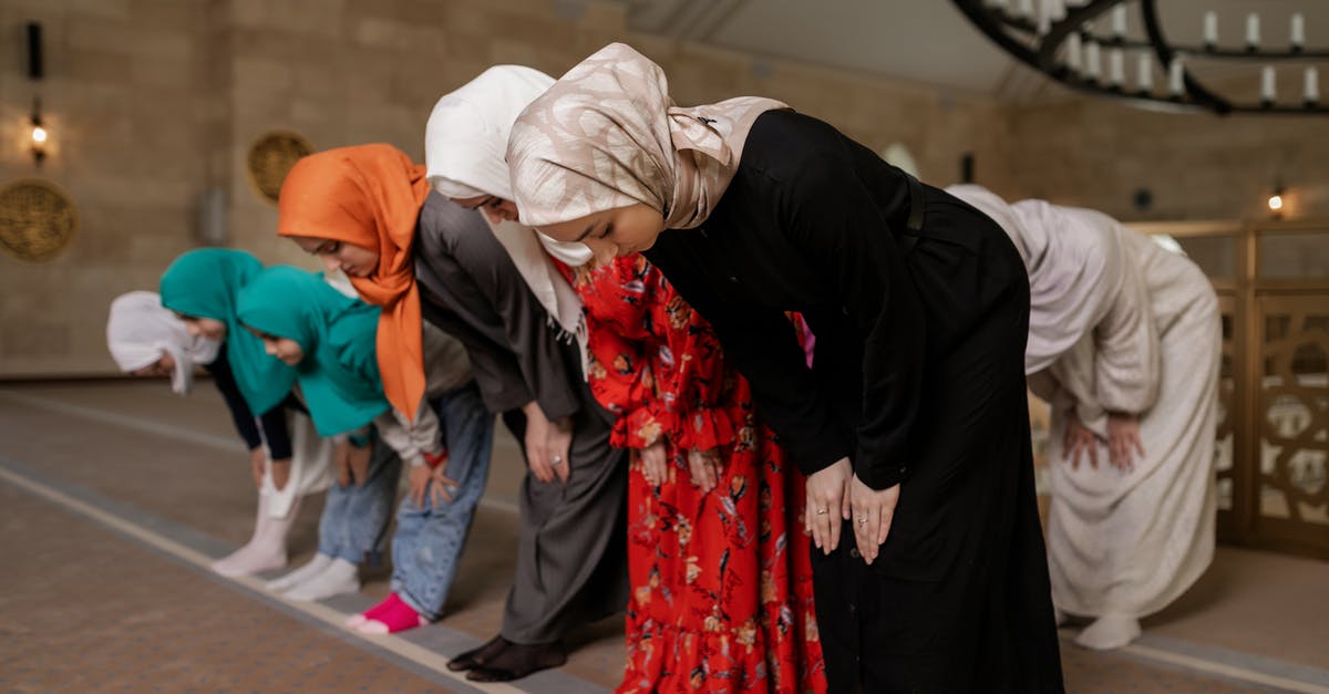 What is Renfield wearing on his hands? - Women and Children Wearing Hijabs Bowing Down 
