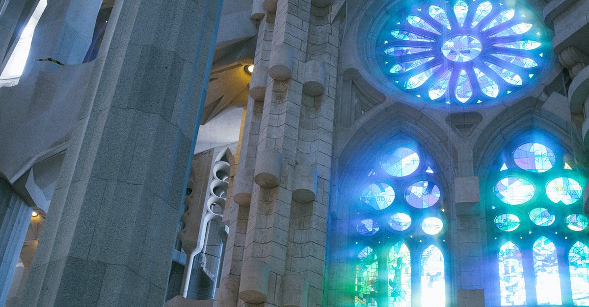 What is that famous diner from When Harry Met Sally? - Low angle of old catholic basilica with stained glass windows named Sagrada Familia located in Barcelona in Spain