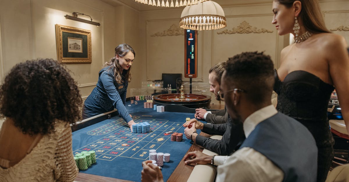 What is the croupier saying during this game of baccarat - People Betting on Roulette Table