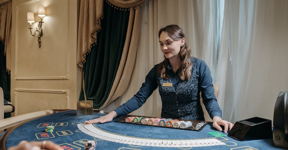 What is the croupier saying during this game of baccarat - A Card Dealer Holding Cards