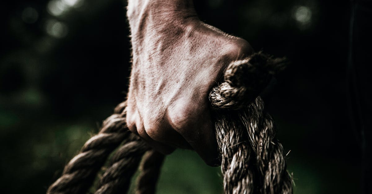 What is the difference between a grip and a key grip? - Man Holding Brown Rope