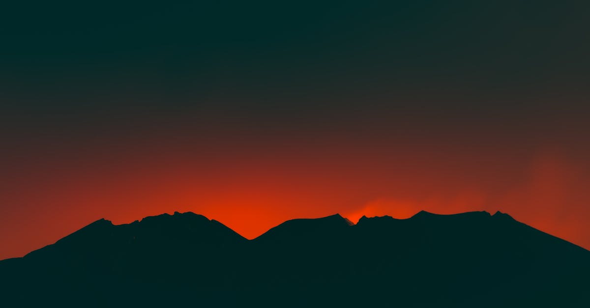 What is the explanation to the ending of the Japanese movie Suicide Club? - Silhouette of Mountain during Sunset