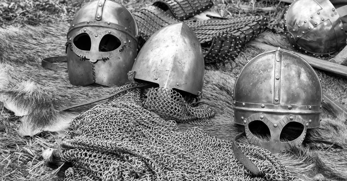 What is the function of Darth Vader's helmet? - Grayscale Photography of Chainmails and Helmets on Ground
