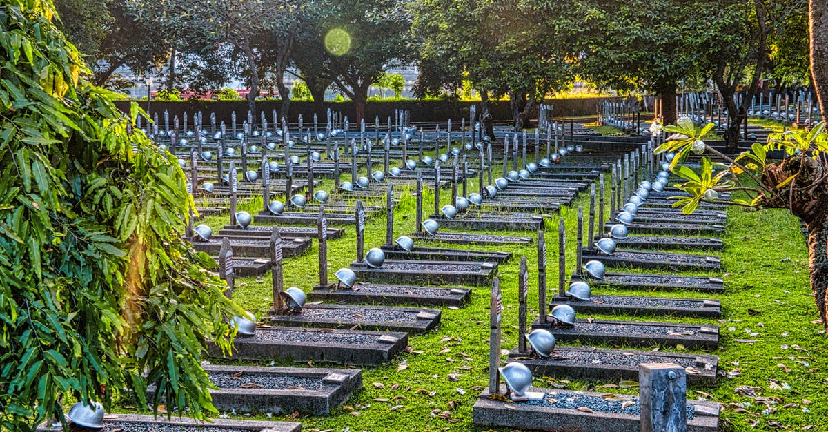 What is the history of the Deathly Hallows? - Gravestones with helmets in cemetery