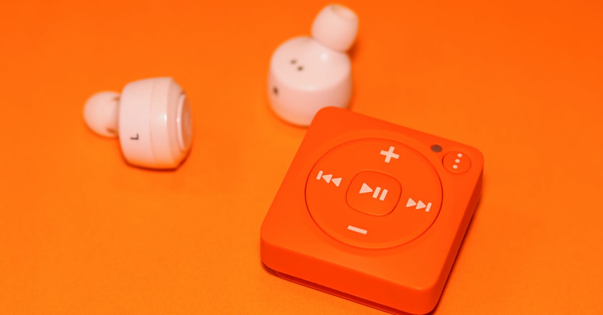 What is the importance of background music in A Clockwork Orange? - White Earphones Beside Orange Music Player