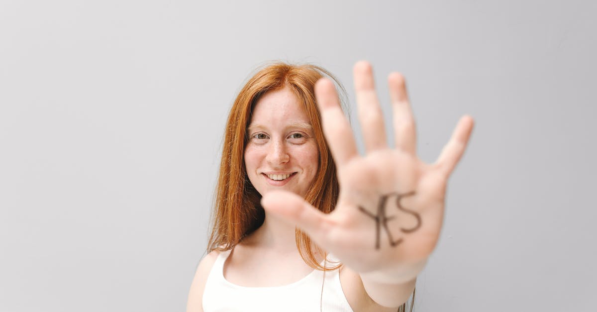 What is the meaning of showing the tapetum lucidum (eye glow) of the replicants? - A Woman Showing the Word Yes on Her Palm