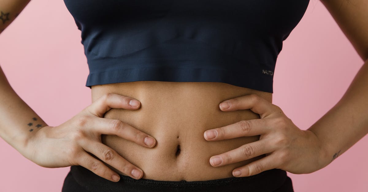 What is the meaning of the belly button? - A Woman Hands on Her Belly