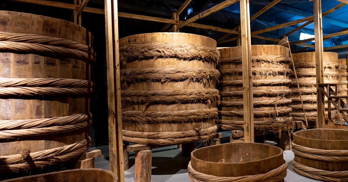 What is the origin of the “double entendre” stock footage trope? - Fish sauce fermenting in wooden large barrels placed in row in local manufacture factory