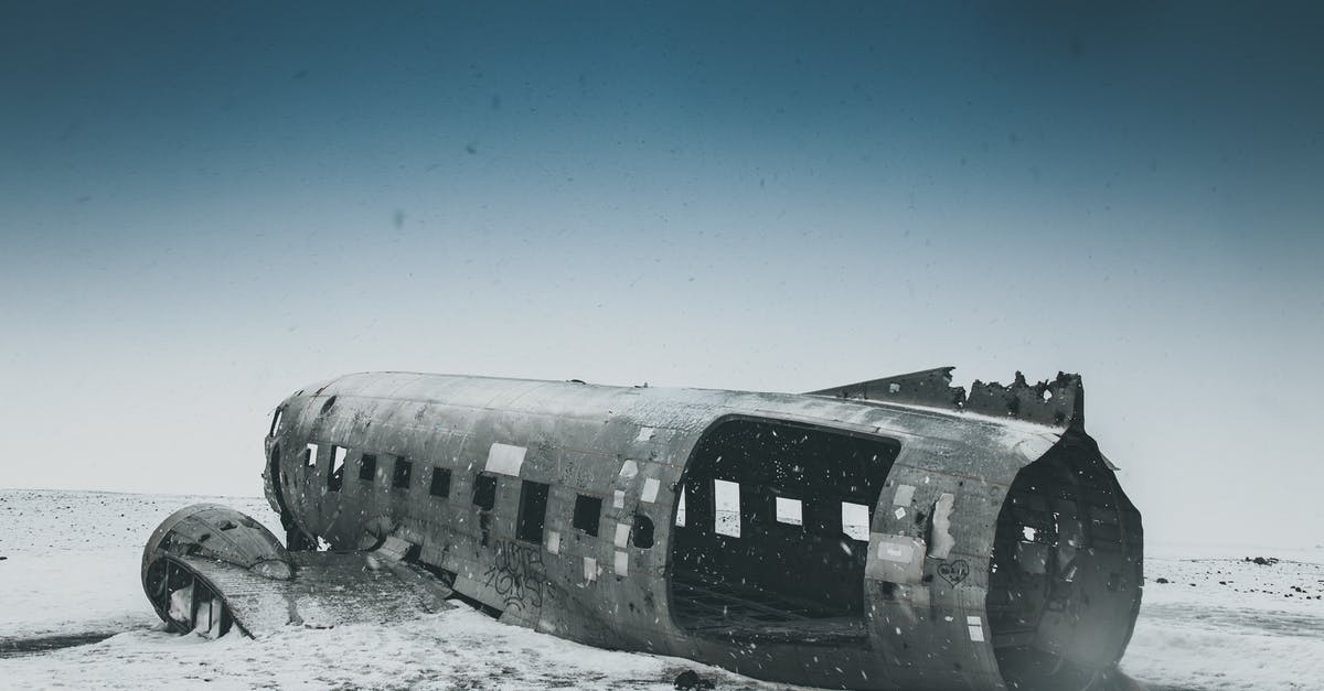 What is the purpose of the Korean captions in Crash Landing on You? - Old weathered aircraft after disaster on snowy land under sky in winter in daytime