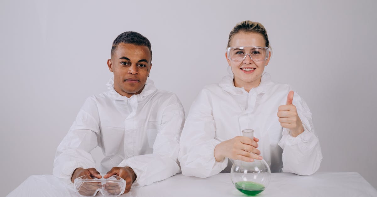 What is the purpose of the lab in The Divide? - 2 Men in White Dress Shirt Holding Drinking Glasses