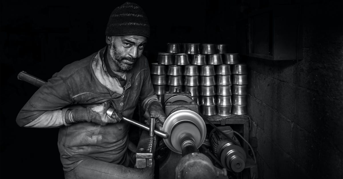 What is the relevance of this in The Machinist? - Gray-scale Photo of Man Making Cups
