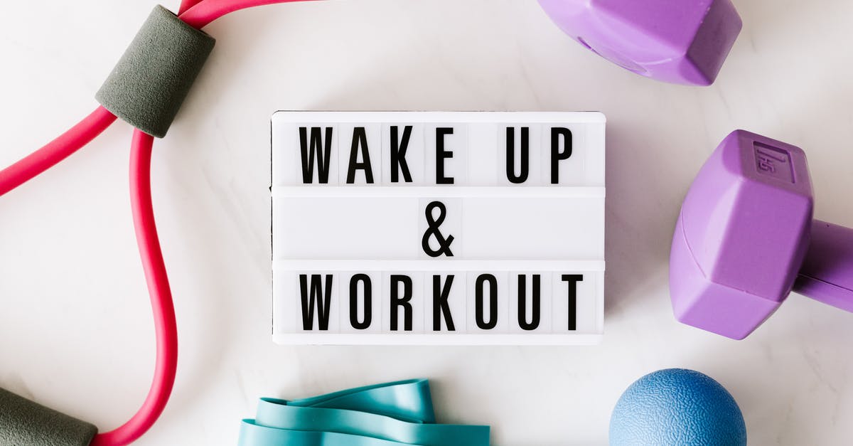 What is the second part of a movie title called? - Wake up and workout title on light box surface surrounded by colorful sport equipment