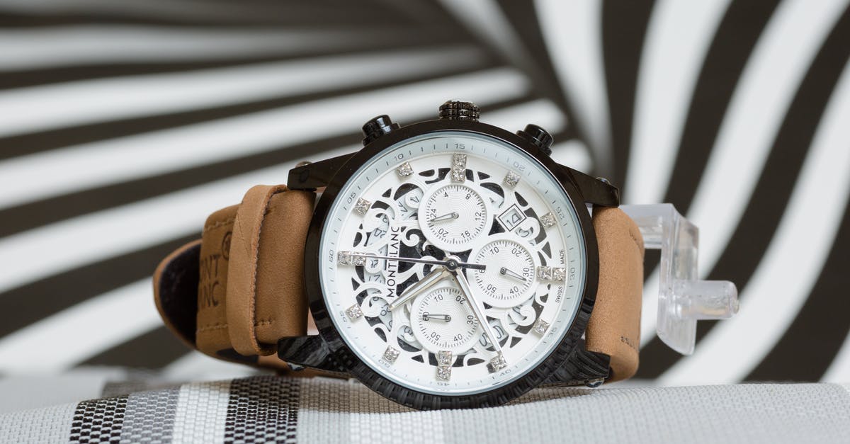 What is the significance behind the black & white photo Sam picks up? - Montblanc Unisex Watch with Black and White Arabesque Pattern on Dial