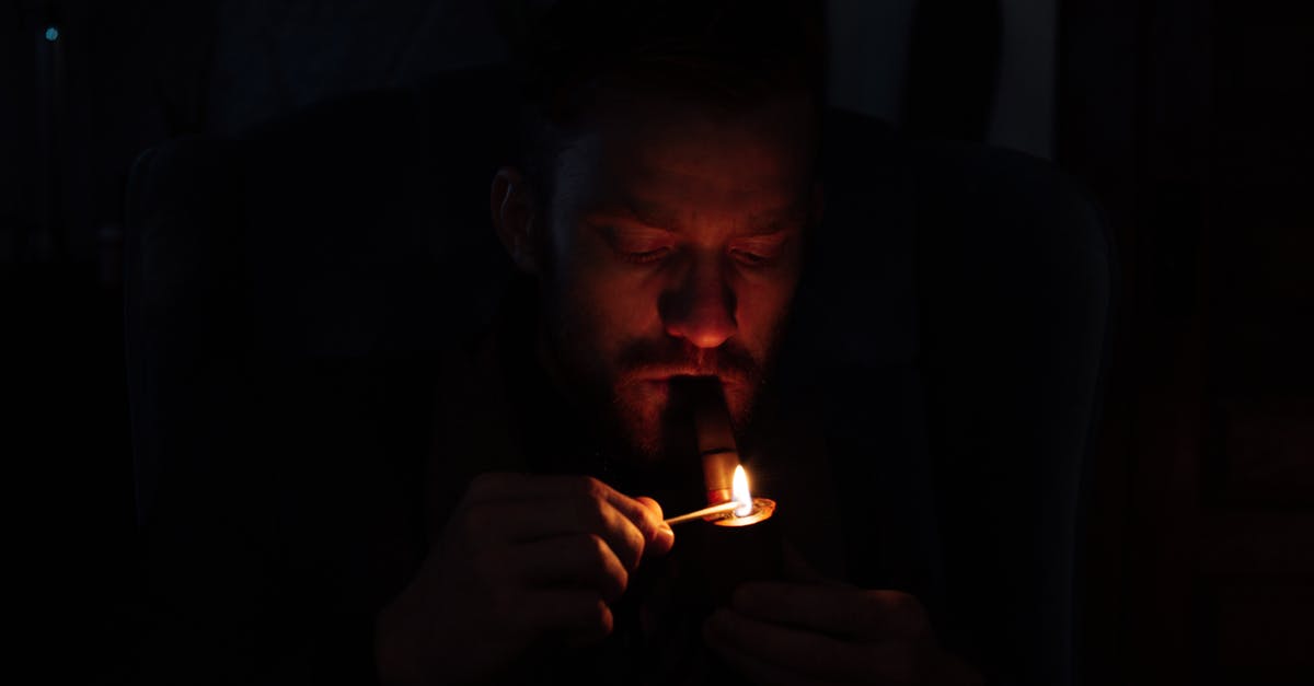 What is the significance of multiple match cuts in Bad Times at the El Royale? - Young man lighting smoking pipe in darkness