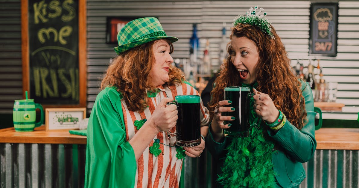 What is the significance of St. Winifred saying that the Green Knight is someone Gawain knows? - A Pair of Women Celebrating St Patrick's Day Holding Glasses of Beers
