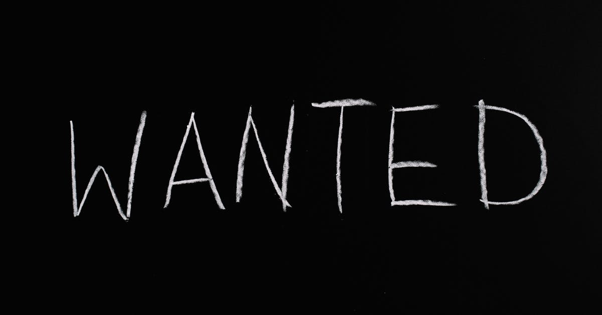 What is the significance of the last scene in "A Most Wanted Man"? - Wanted Lettering Text on Black Background