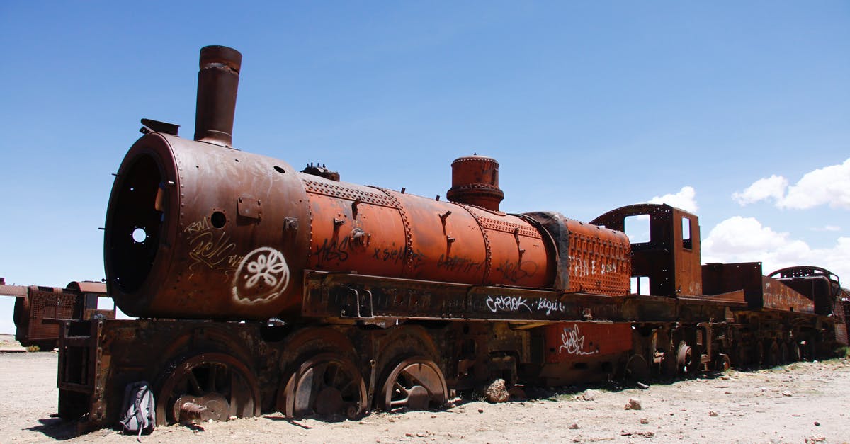 What is the Significance of the train wreck in Hugo? - Abandoned Rusty Train on a Wasteland