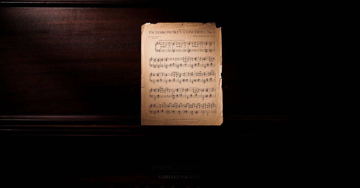 What is the significance/reference of a character repeatedly hitting a piano note? - Photo Of Music Notes Leaning On Wooden Piano
