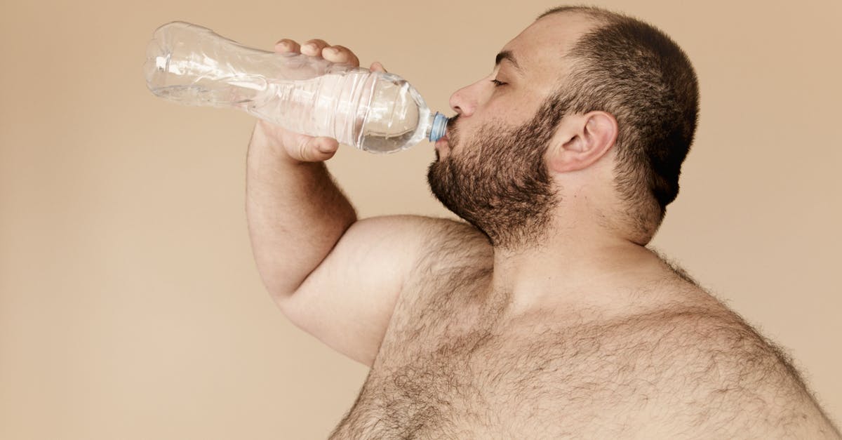 What is the source of inspiration for the Fat Bastard character? - Man Drinking from Clear Plastic Bottle