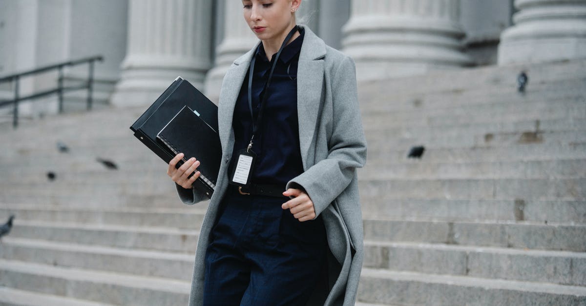 What is the state of Rittenhouse following the finale? - Serious businesswoman hurrying with documents from courthouse