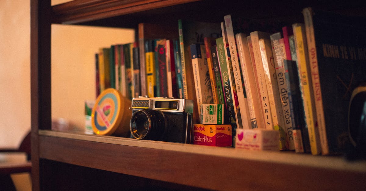 What is the technique called when series of events in a film are played in reverse order? - Black Vintage Camera on Bookshelf
