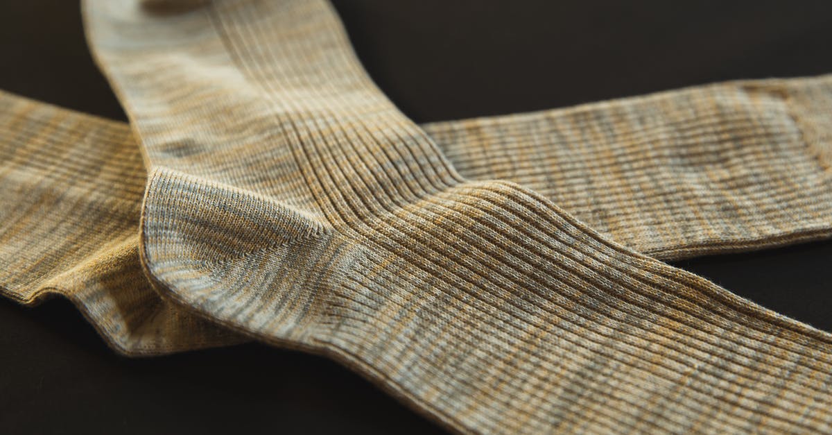 What is the term for a cut from one close-up object to another absurdly similar close-up object? [duplicate] - From above of pair socks made of soft material placed above each other on black background