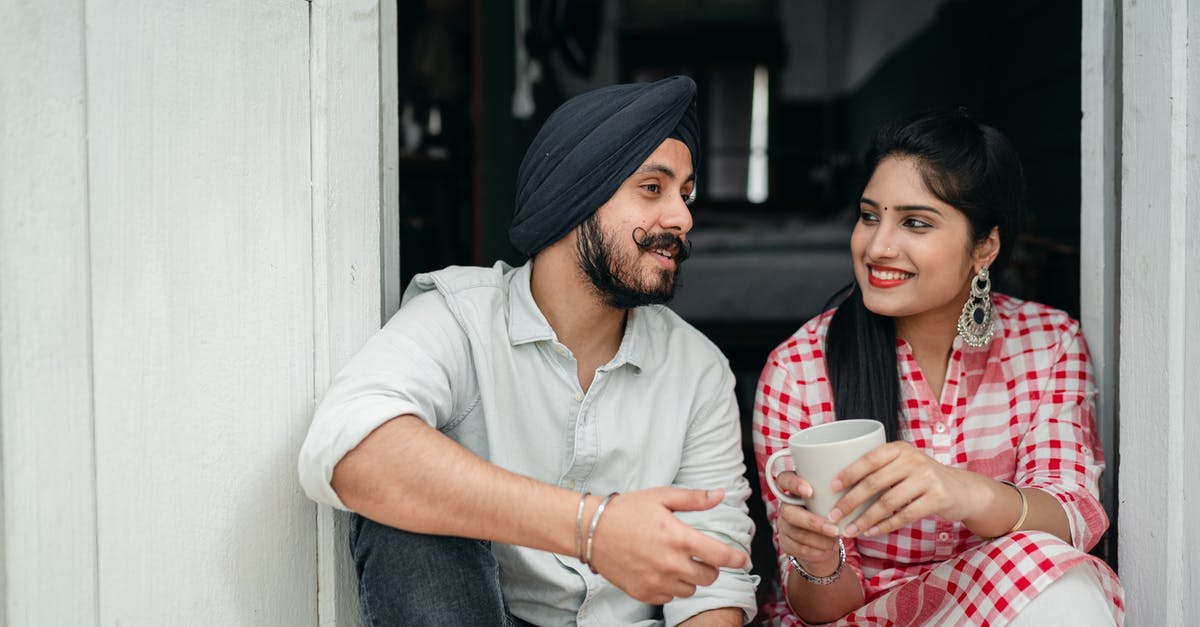What is this cinematic story telling technique called? - Positive Indian spouses in casual outfits sharing interesting stories while drinking morning coffee on doorstep of house
