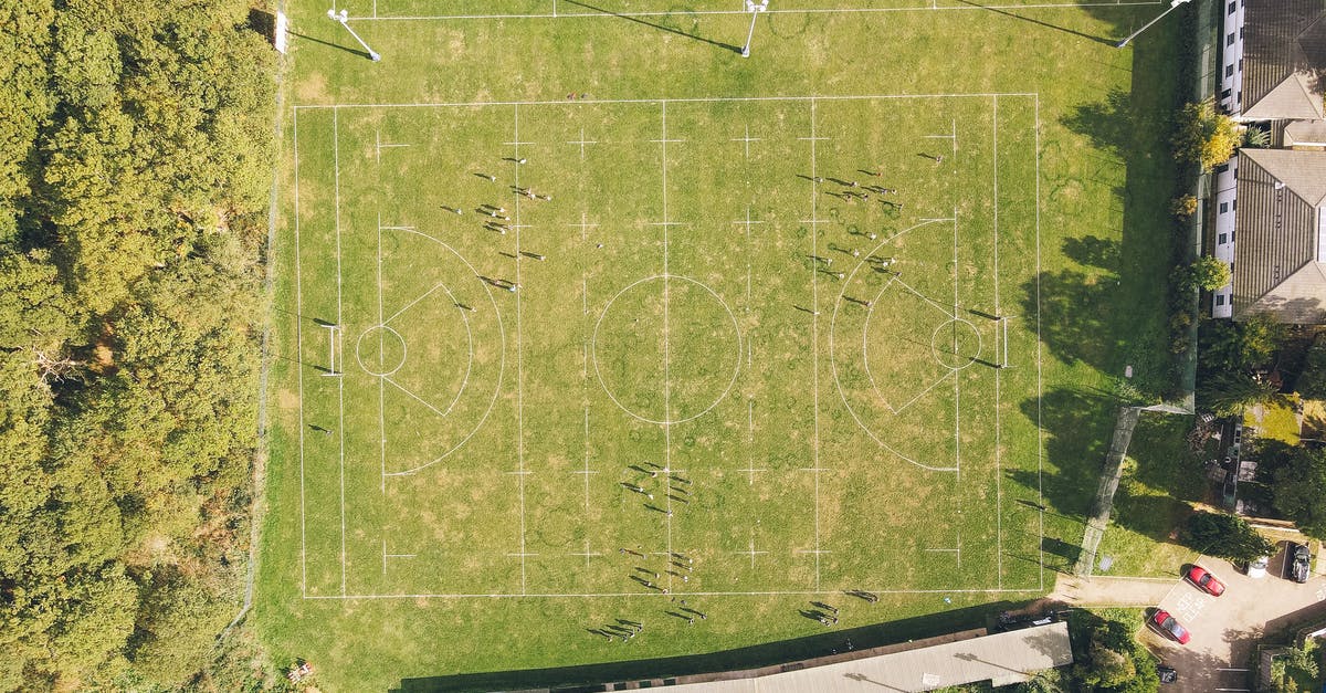 What is this meme from "Stewie joins a football team"? - Drone view of rugby pitch surrounded by lush green trees near old residential houses on sunny day in countryside