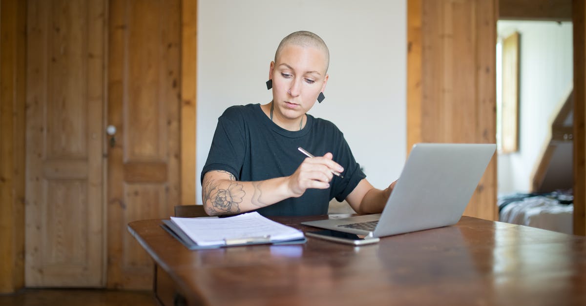 What is Vern's role at the recovery house? - A Bald Woman Working From Home Using Her Laptop