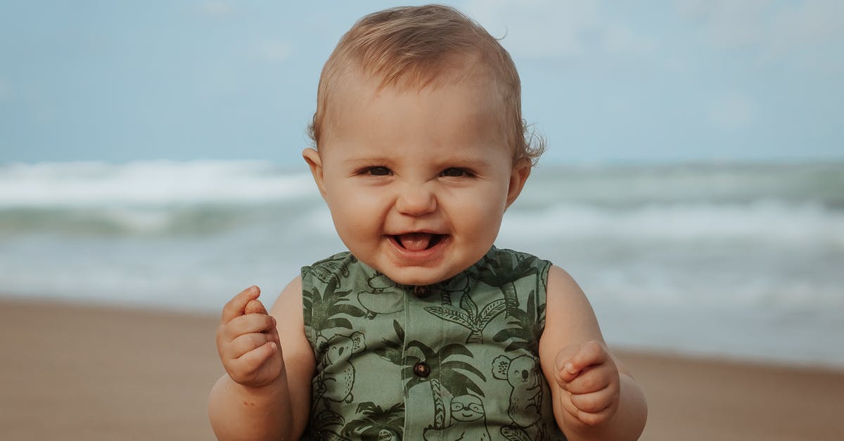 What kind of maze was Dom looking for in Inception? - Cheerful baby on sandy sea shore in stormy weather