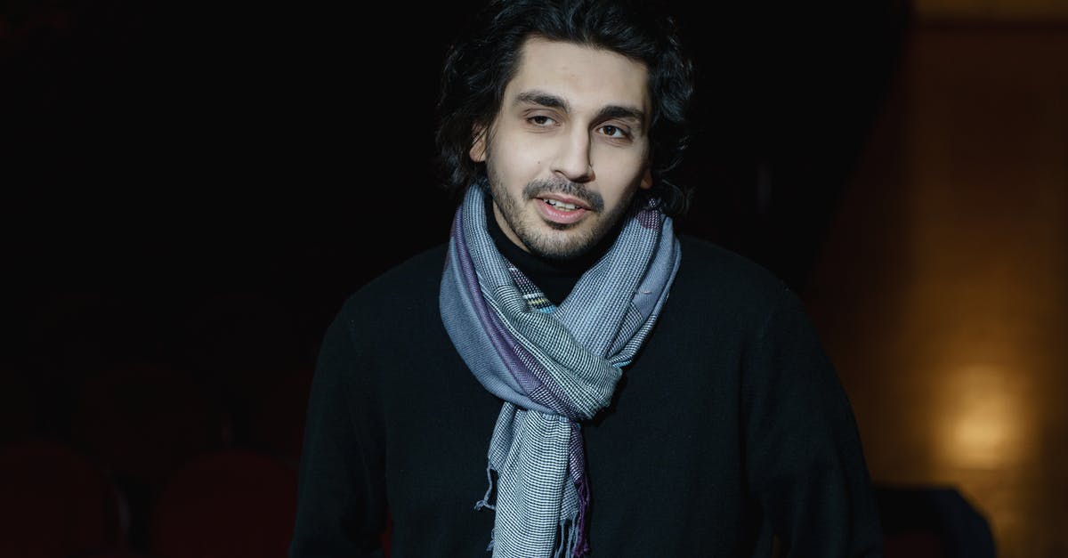 What movie is playing in the theater in Conspiracy Theory? [closed] - Photo Of A Man With Scarf