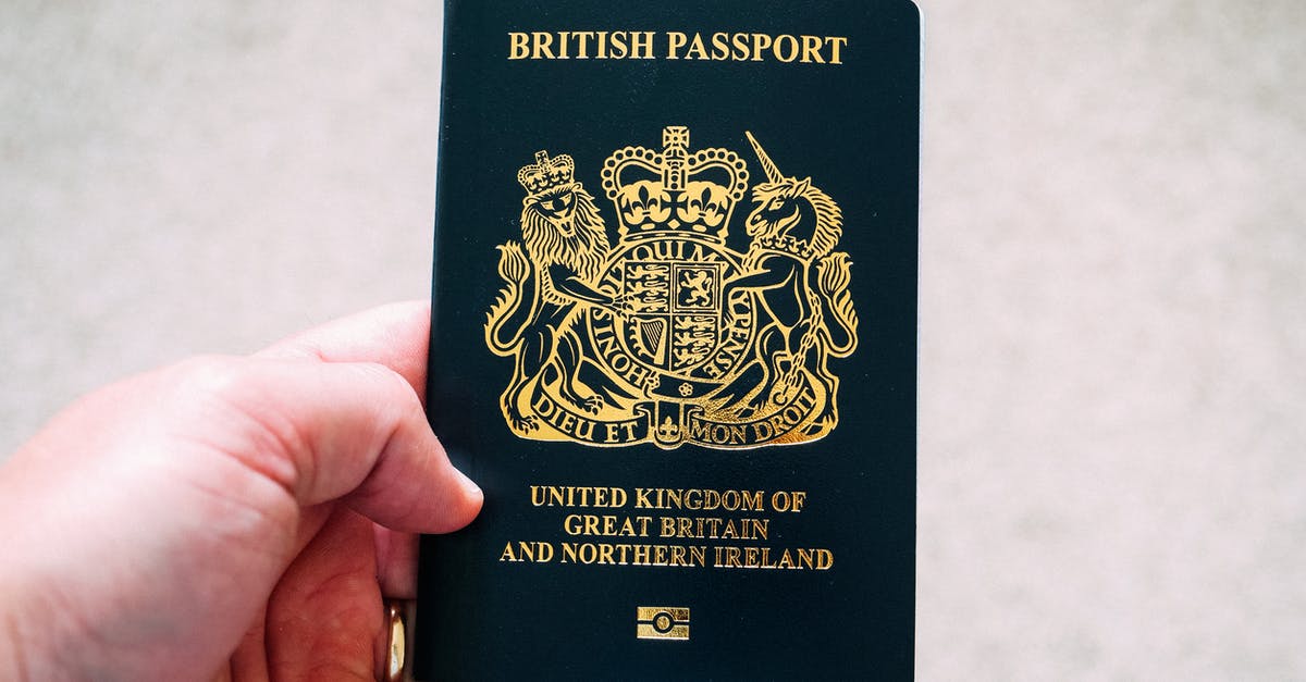What nationality is Bane? - Crop unrecognizable person demonstrating British passport