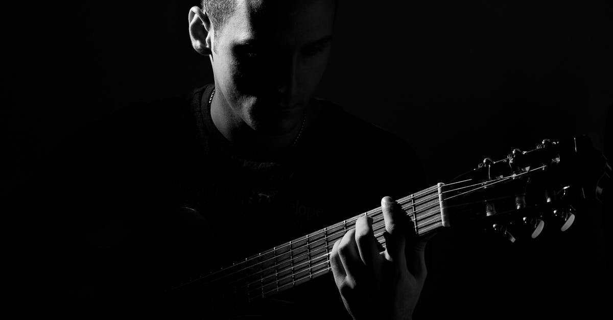 What pop culture reference is Jessica Jones making? - Grayscale Photo of Man Playing Guitar