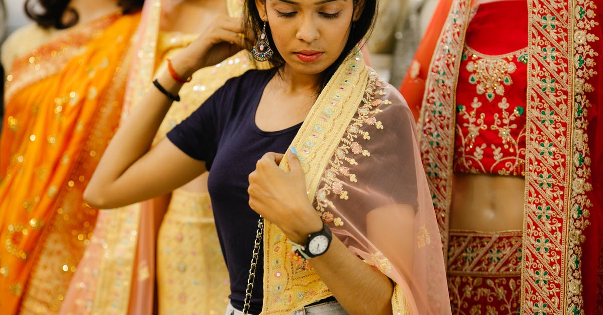 What "thing" are the Indians trying to win? - Woman in Trying the Yellow Sari from the Mannequin
