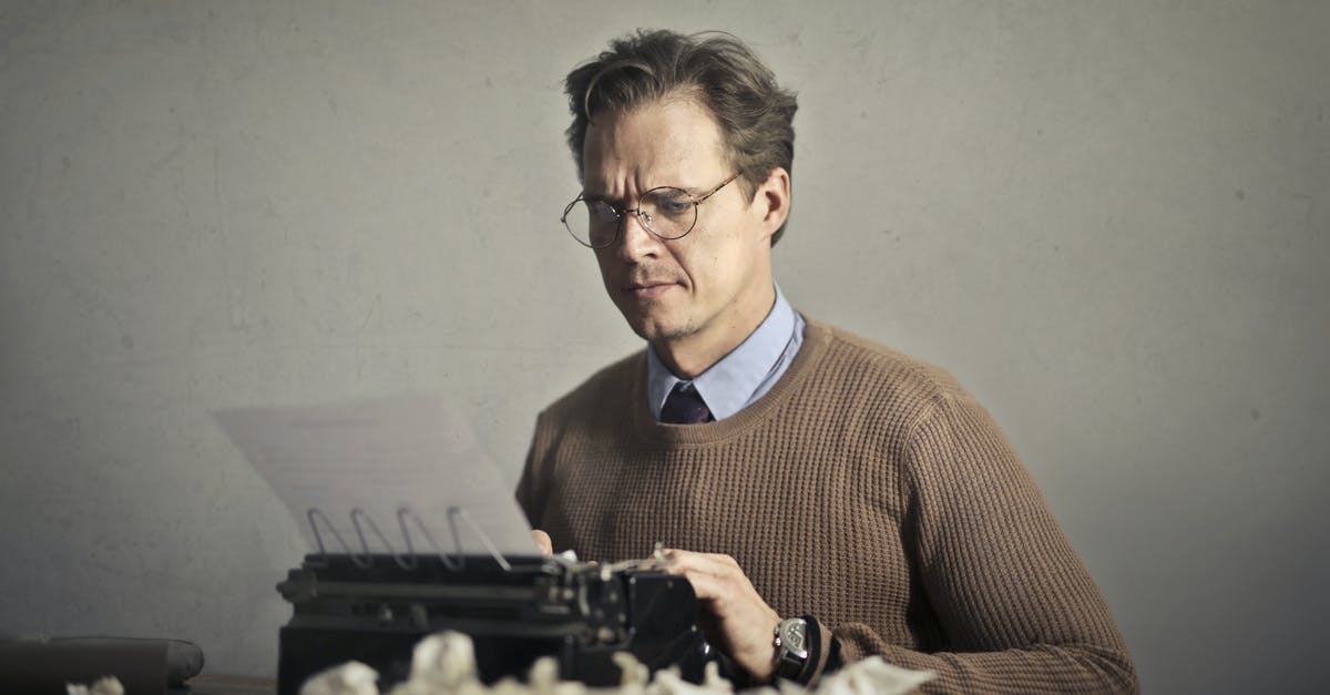 What story is the music video Snuff trying to portray? - Adult frowned male writer working on typewriter at home