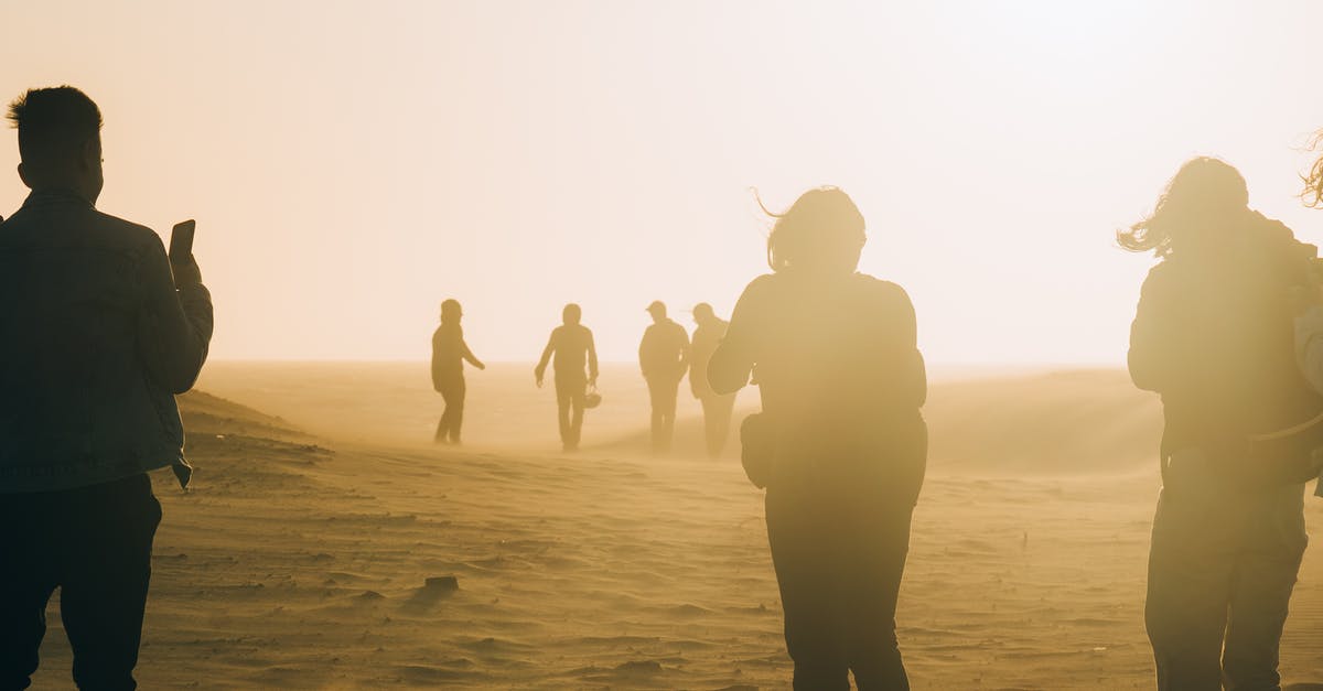 What was in the present from Robert to Sandy in A Patch Of Fog - People Walking on Desert On A Windy Day With Dust Clouding Around Them 