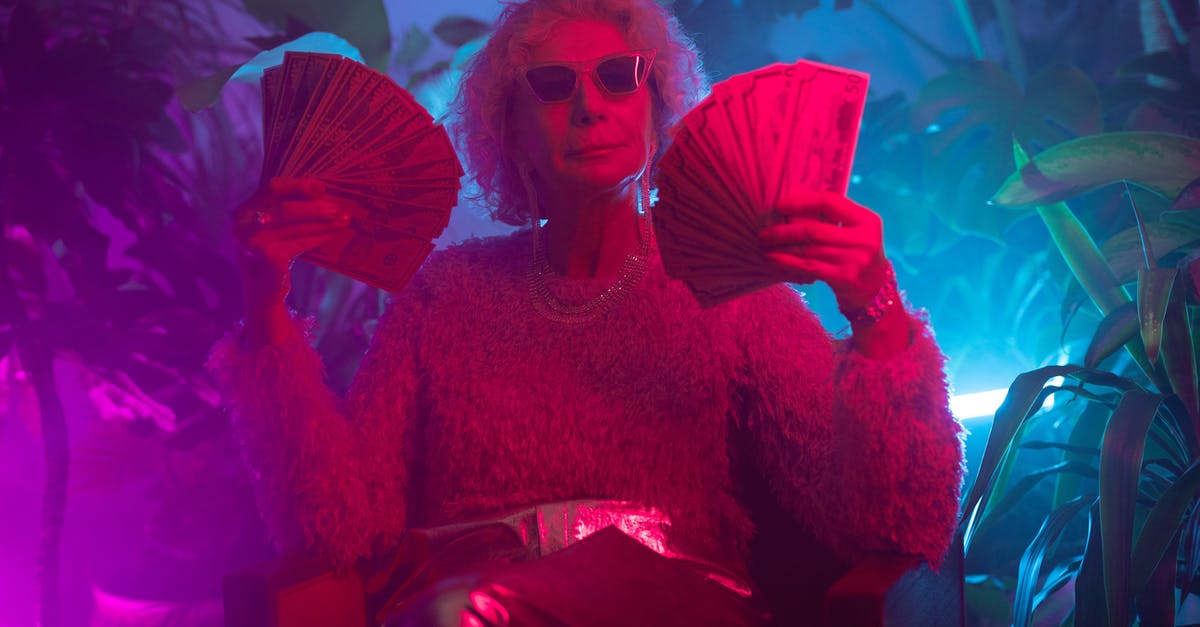 What was Kyle really after in Money Monster? - Photo of an Elderly Woman Holding Money 
