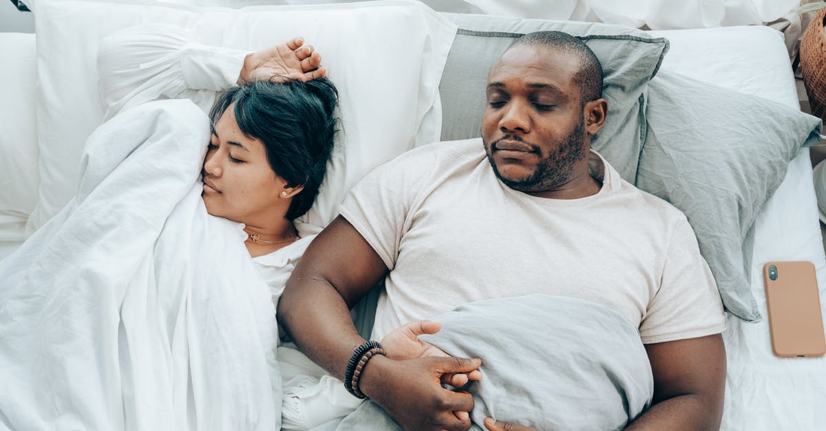 What was Paul trying to achieve by lying to his wife in the final episode of the first season? - Young multiethnic spouses sleeping in bed holding hands