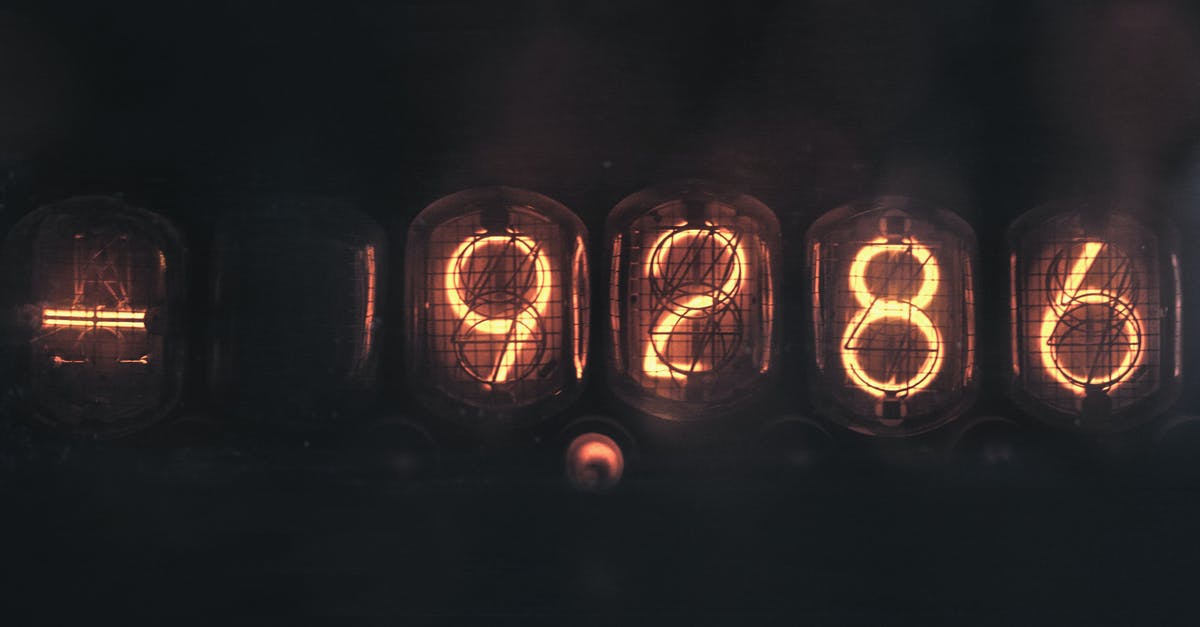 What was really behind the mysterious number sequence in Lost? - Electronic numerical counting machine with yellow illuminated number sequence using old fashioned tubes placed on black background in dark room