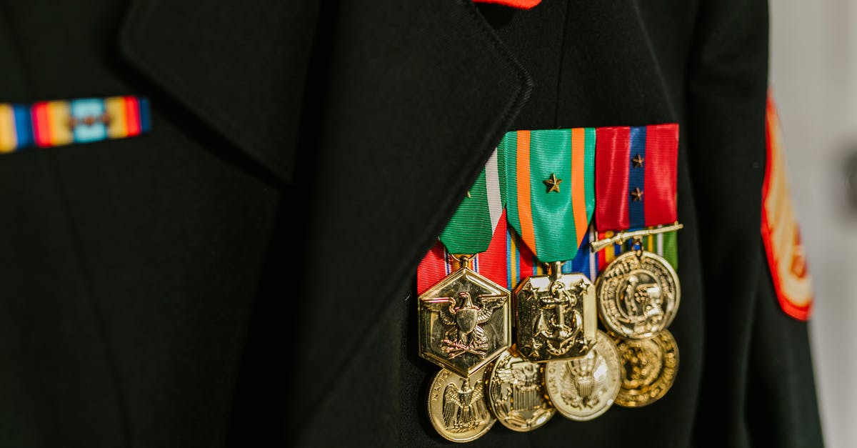 What was the medal that Ethan gives his niece in The Searchers (1956)? - Close-Up Photo of Navy Uniform with Gold Medals